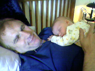 Infant and Dad sleeping